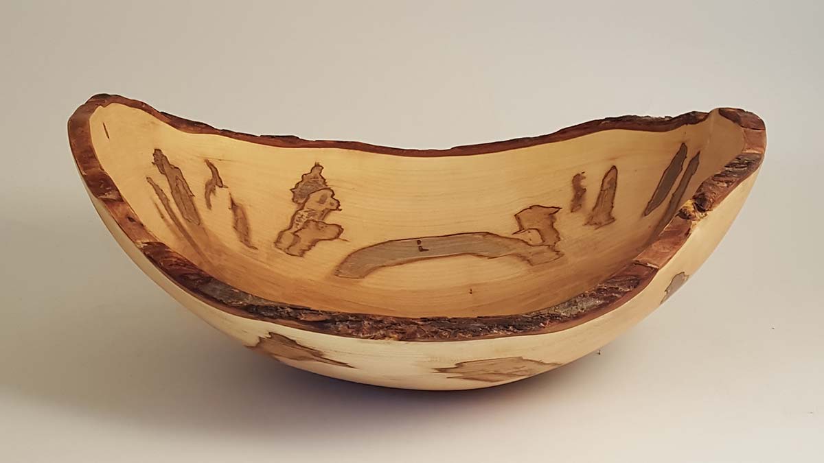 Live edge ambrosia maple bowl with visible streaking along the rim