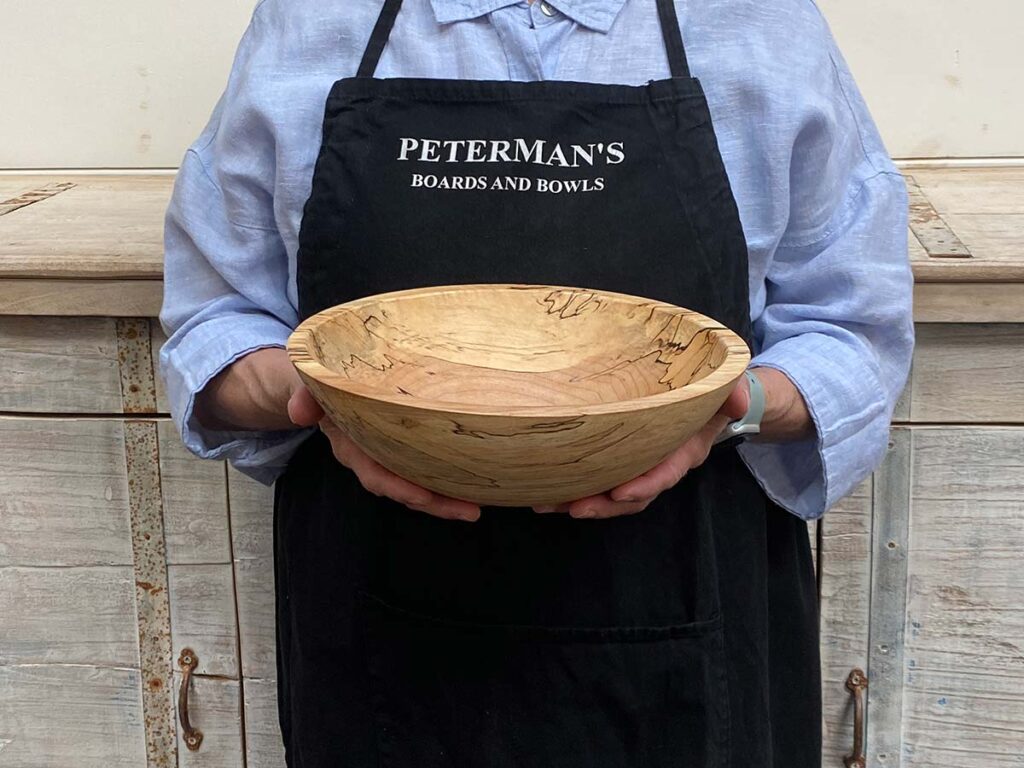 Small 10-inch spalted maple round wooden bowl, featuring natural spalting patterns and smooth finish.