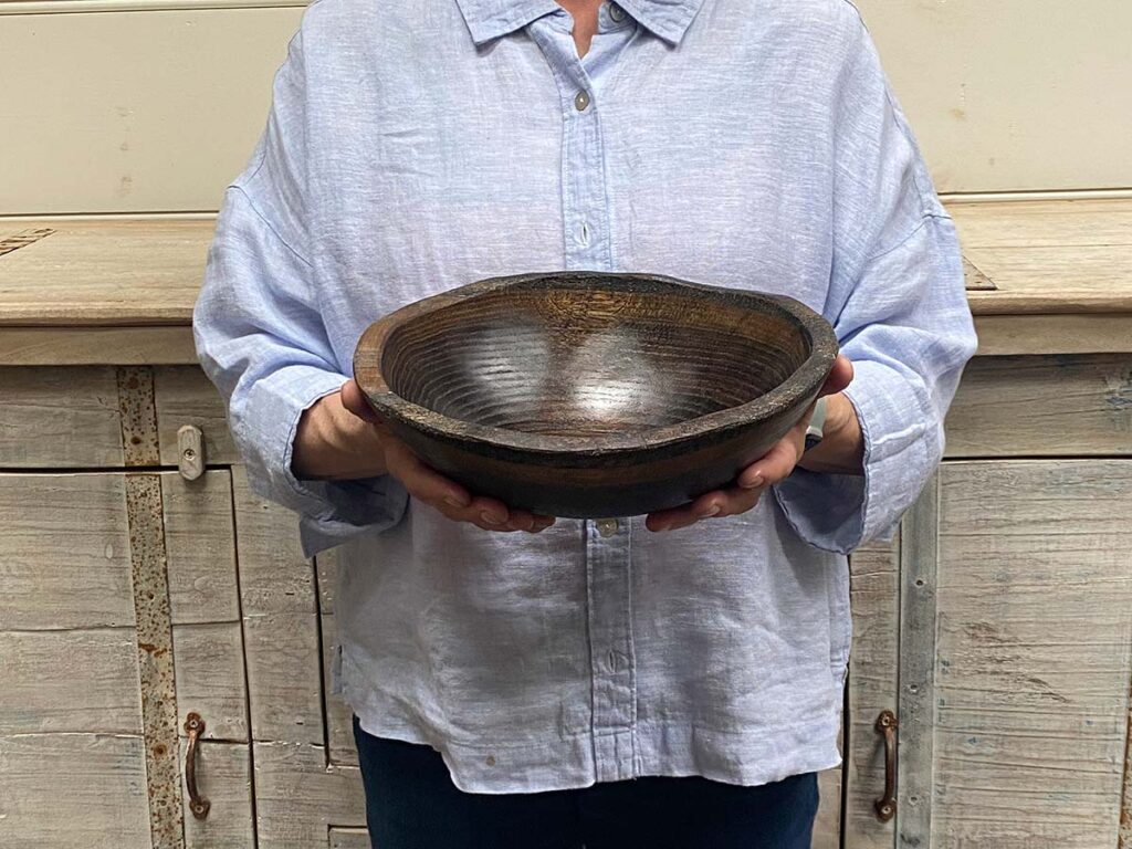 Small 10-inch ebonized oak oval, live edge wooden bowl, food-safe and artisan-crafted with a deep black finish.