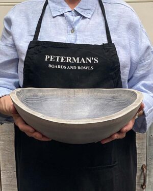 Medium 13-inch driftwood oak oval, live edge wooden bowl, rustic live edge shape with gray-toned finish.