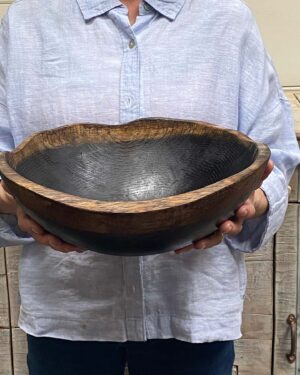 Medium 13-inch ebonized oak oval, live edge wooden bowl, bold dark finish with handcrafted oval form.