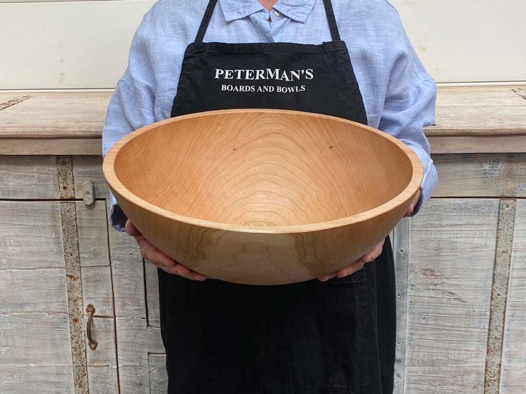 Large 15-inch cherry wooden bowl, handcrafted round design, food safe for serving or salad use.