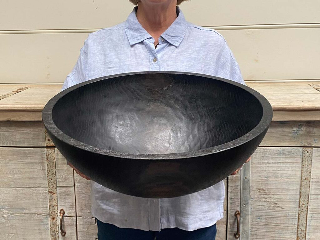 Extra large 18-inch ebonized oak round wooden bowl, striking black finish, food safe handcrafted serving piece.