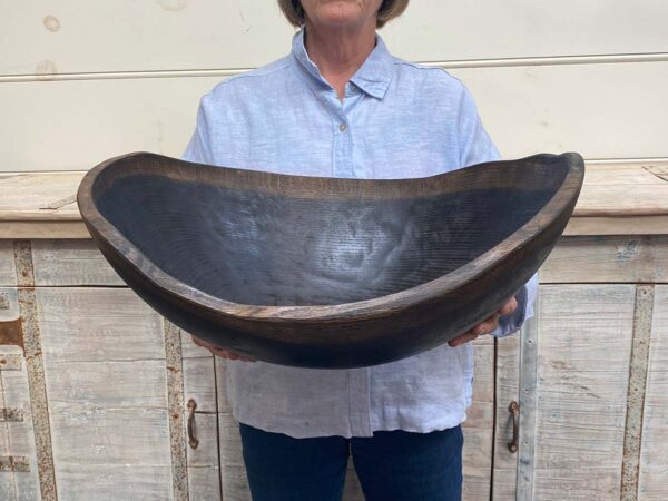 XXL jumbo 21-inch Ebonized Oak oval wooden bowl, handcrafted with a unique live edge design, food-safe for entertaining.