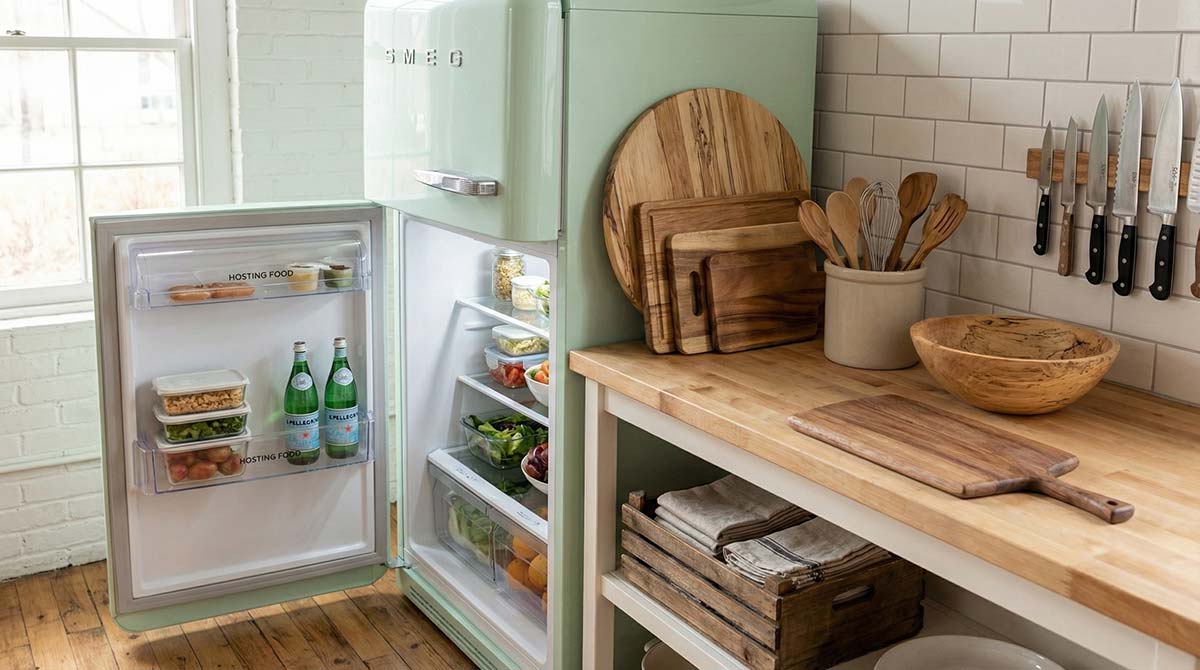 Organized holiday kitchen with refrigerator door open and counters cleared for prep.