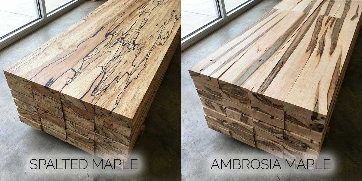 Stacks of spalted maple lumber next to ambrosia maple boards highlighting grain and color differences