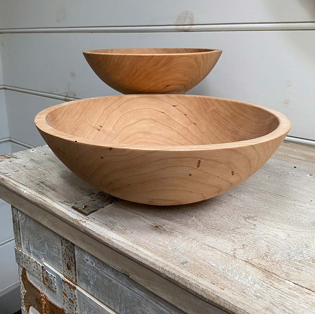 Medium (13") and small (10") round cherry wooden bowls