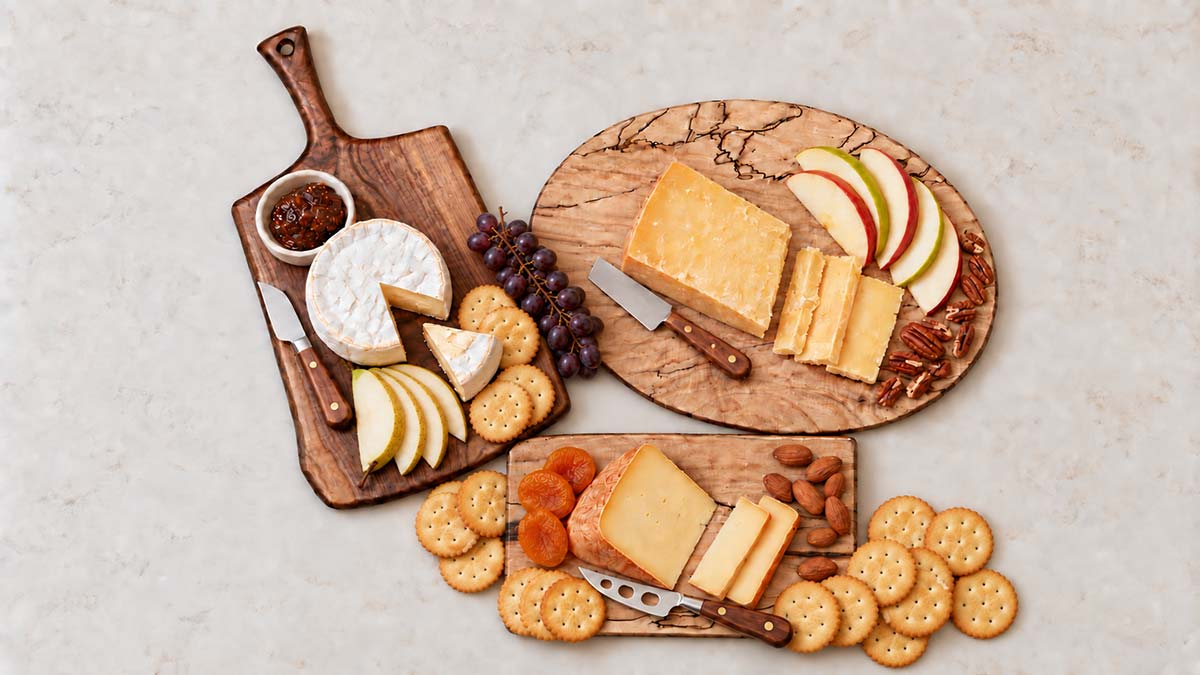 cheese board with cheese, fruit and crackers